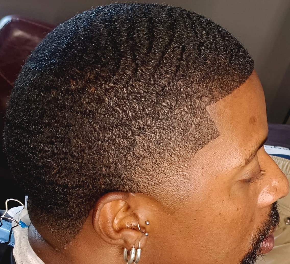 Side profile of a beard fade haircut