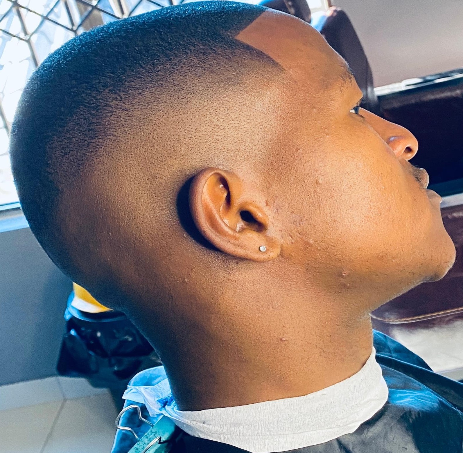 Side profile of a low fade haircut